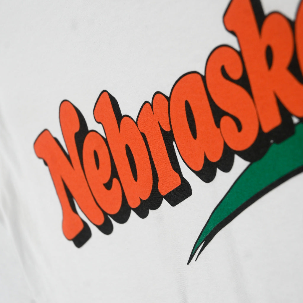 Retro Nebraska orange graphic detail with black shadow on cotton shirt