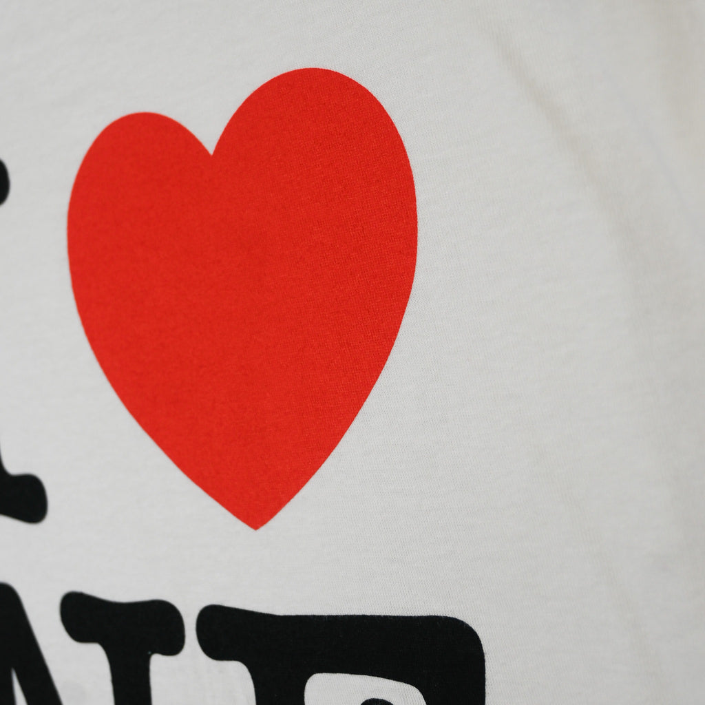 Close-up of red heart screen print on I Love NE ringer shirt