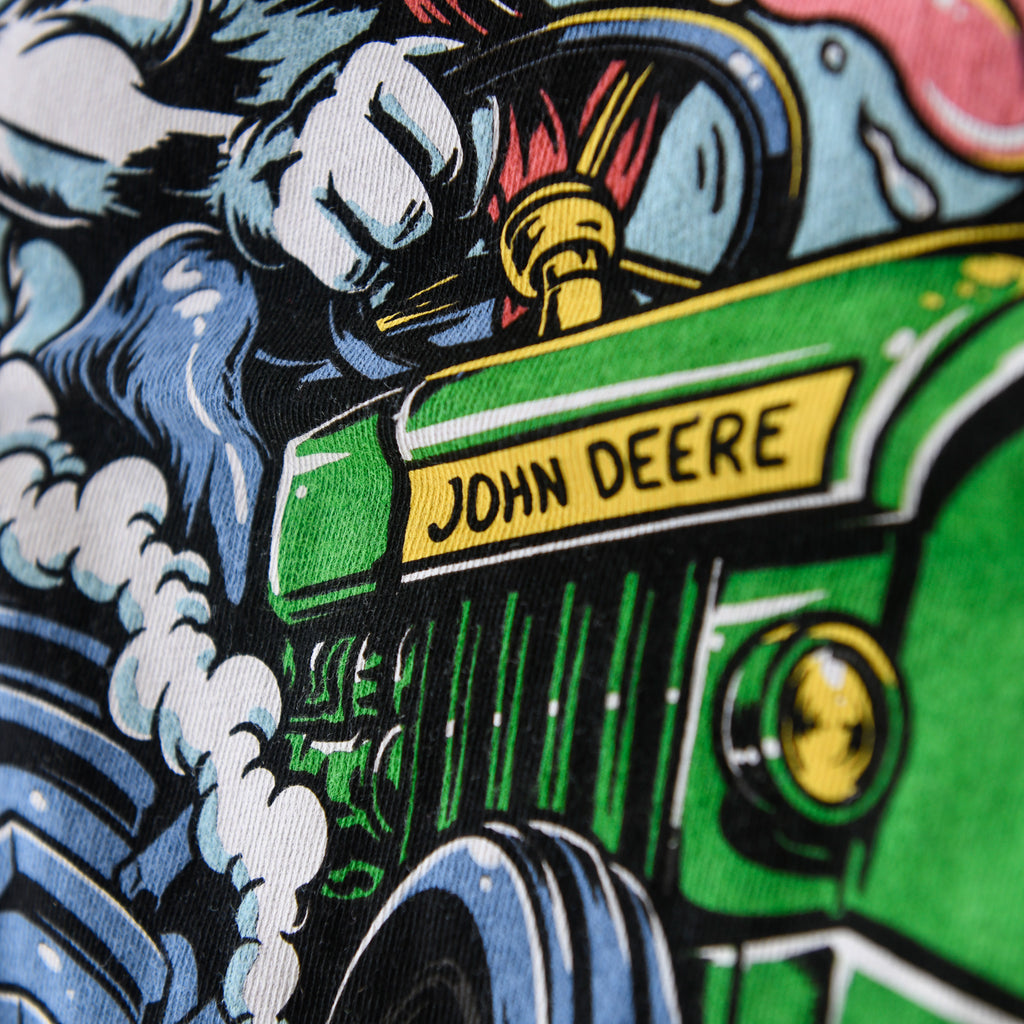 Close-up of tractor lettering in the black tee discharge print