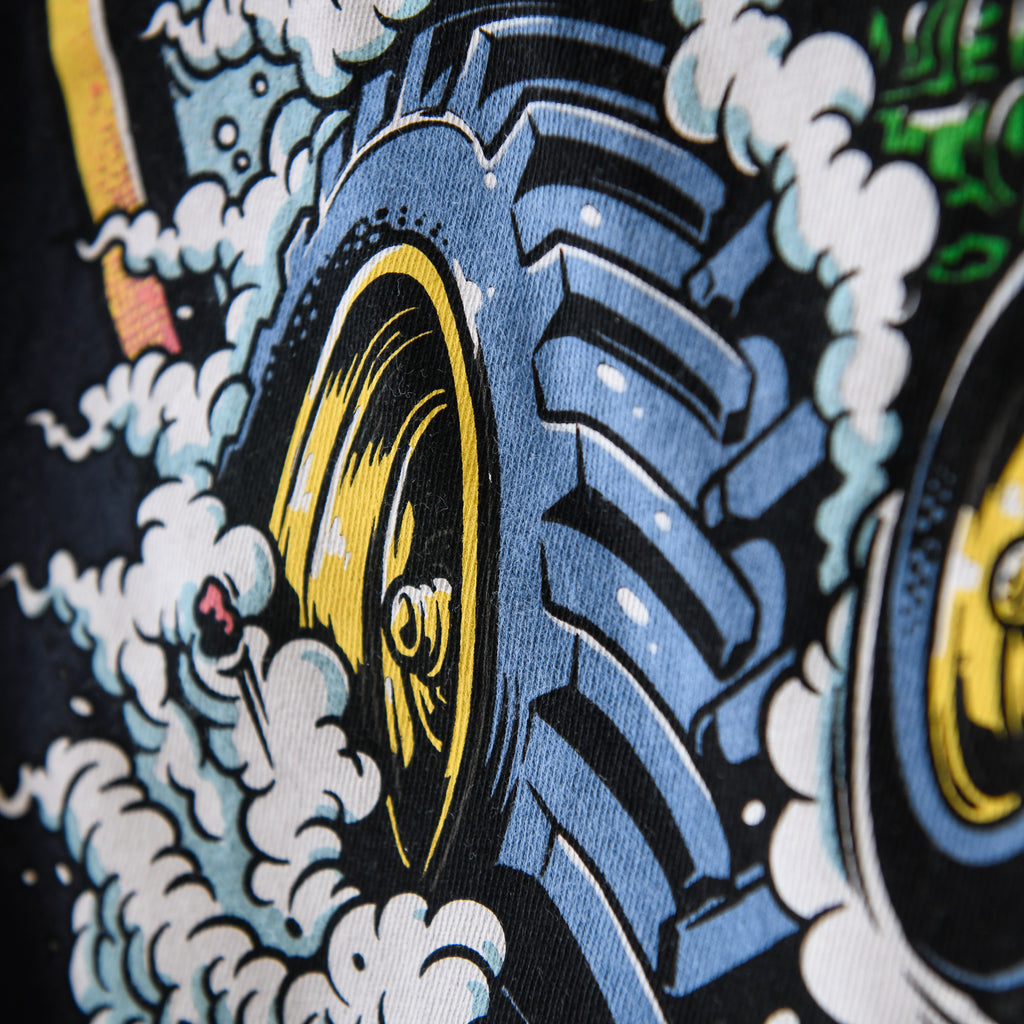 Tractor tire and smoke detail on black Nebraska Corn Fiend tee