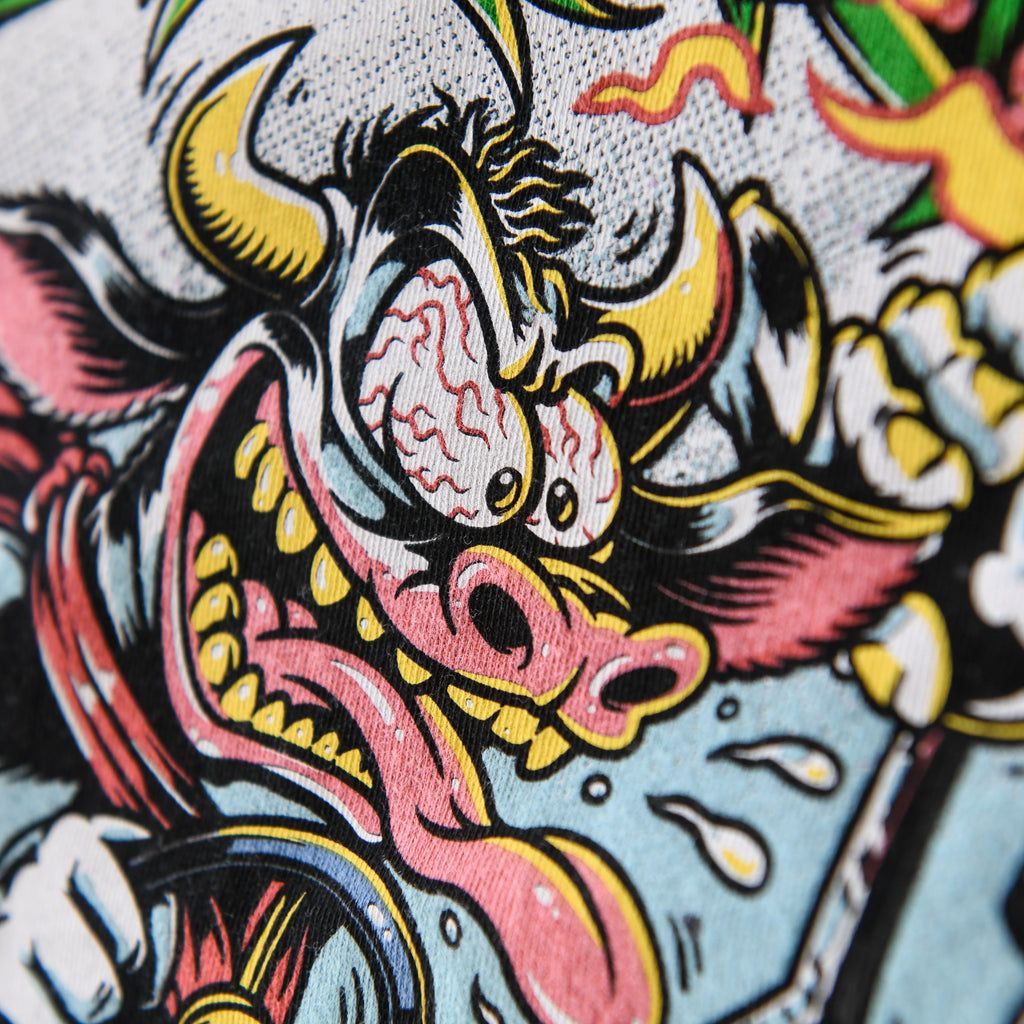 Wild-eyed cartoon cow close-up on black Nebraska Corn Fiend tee