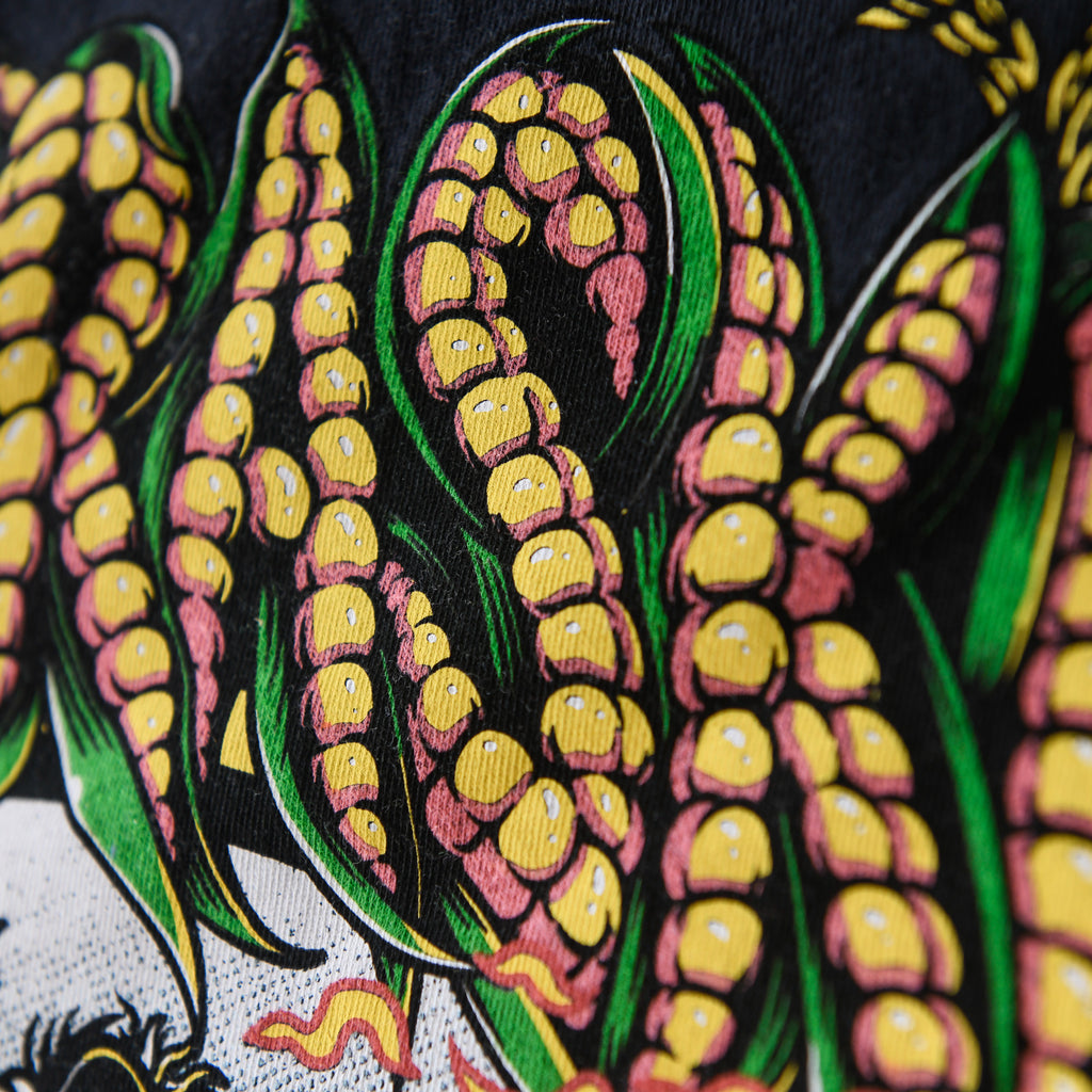 Yellow corn lettering and green husk detail on black Nebraska Corn Fiend tee