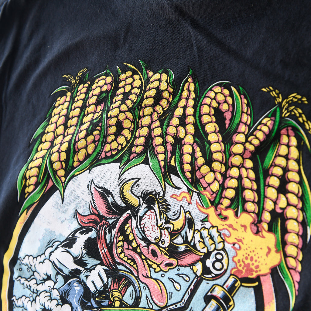 Nebraska corn lettering, cow and eight-ball shifter on black tee back print