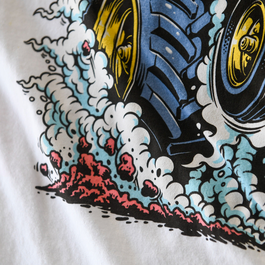 Tractor tire, smoke and dirt detail on white Nebraska Corn Fiend tee