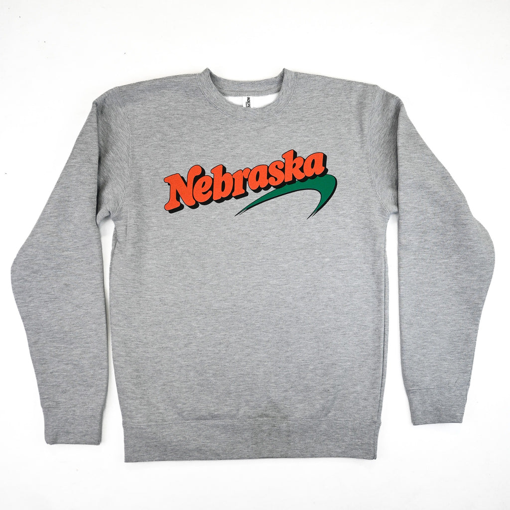 Heather gray Newbraska 100s crewneck sweatshirt with orange Nebraska lettering and green swoosh, front view