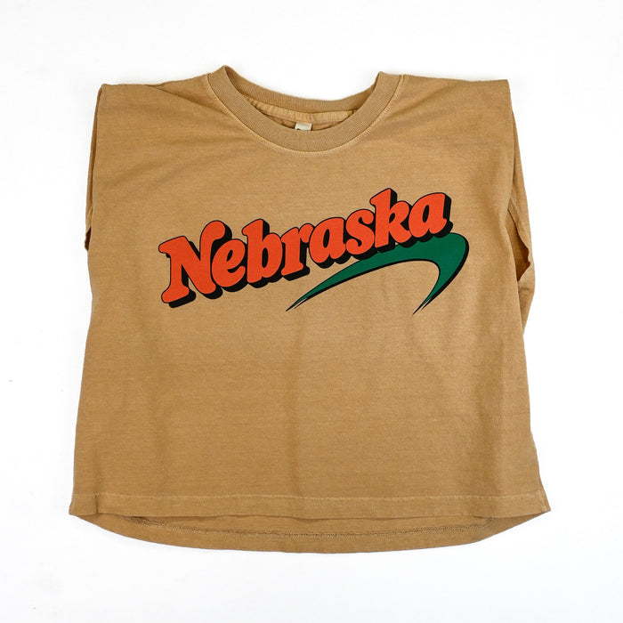 Front view of Newbraska 100s tan heavyweight T-shirt with retro orange Nebraska lettering and green swoosh