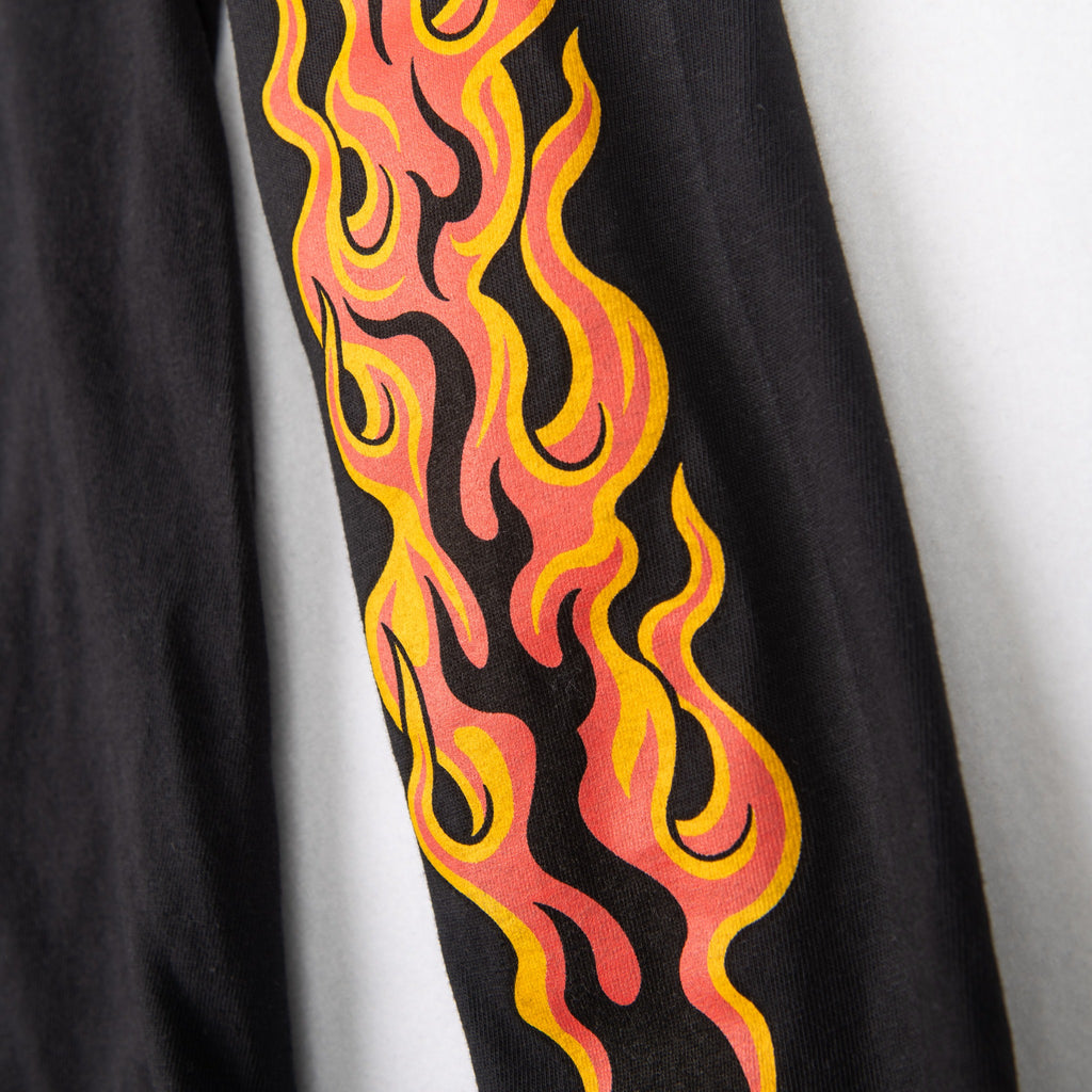 Black shirt sleeve detail with pink and yellow flames