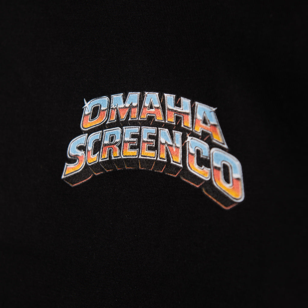 Close-up of multicolor Omaha Screen Co logo printed on black fabric