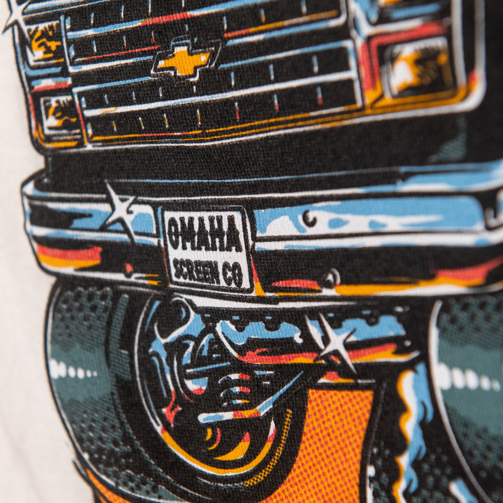 Screen printing detail of Omaha Screen Co van grille, bumper and license plate on ringer tee